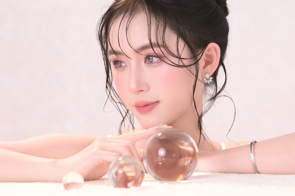 Elegant portrait of a woman with crystal balls, conveying a dreamy and ethereal mood.