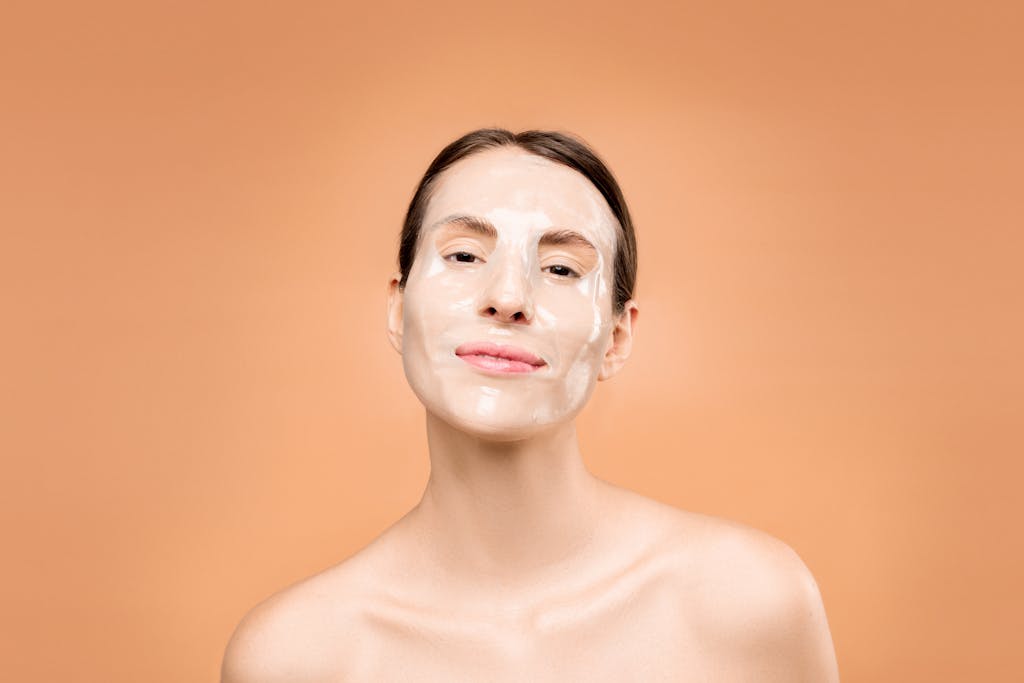 Portrait of a woman with a facial mask, promoting skincare and beauty routines.